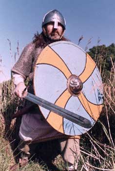 * A warrior equipped with mail, helm, shield and sword
